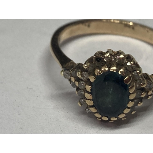 503 - A 9 CARAT GOLD RING WITH TOPAZ SURROUNDED BY DIAMONDS ALSO ON THE SHOULDERS SIZE R/S GROSS WEIGHT 3.... 