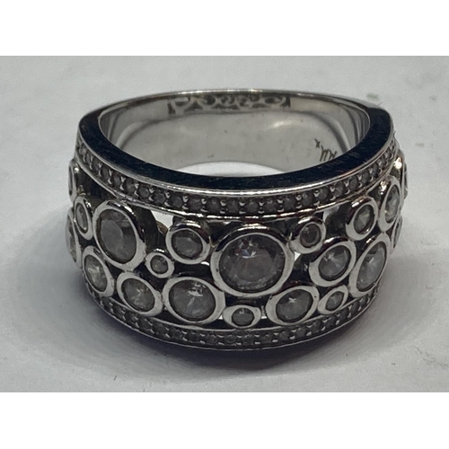 615 - A SILVER DRESS RING IN A PRESENTATION BOX