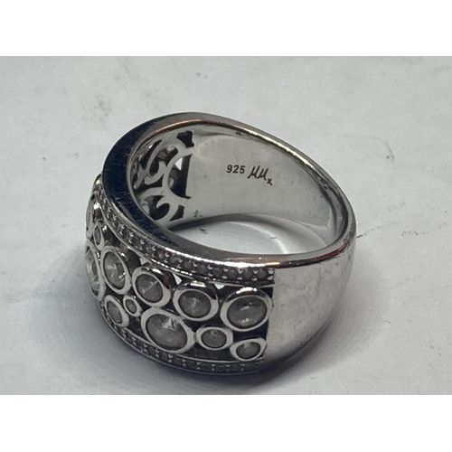 615 - A SILVER DRESS RING IN A PRESENTATION BOX