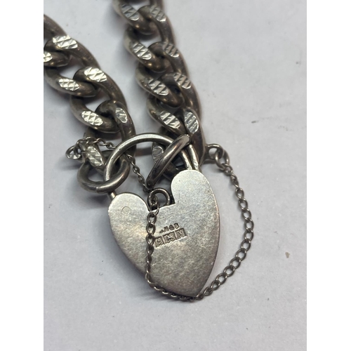 618 - A MARKED SILVER WRIST CHAIN WITH SILVER HEART CLASP