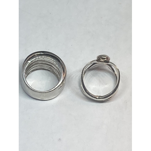 619 - TWO SILVER DRESS RINGS