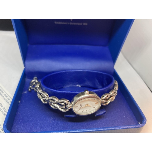 625 - A SILVER ROTARY WRIST WATCH IN A PRESENTATION BOX