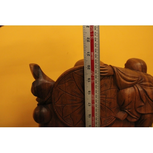 63 - A CARVED WOODEN LAUGHING BUDDAH FIGURE 20