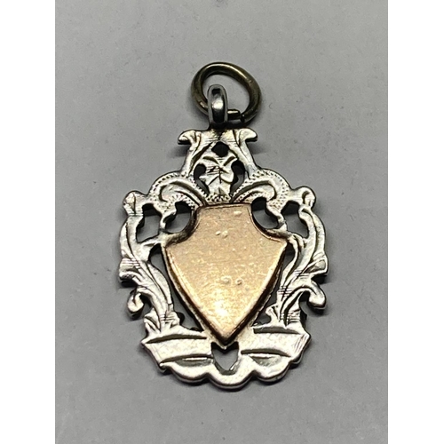 643 - A SILVER AND GOLD WATCH FOB