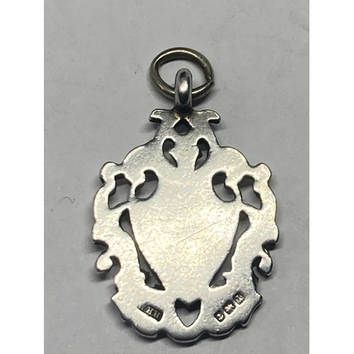 643 - A SILVER AND GOLD WATCH FOB