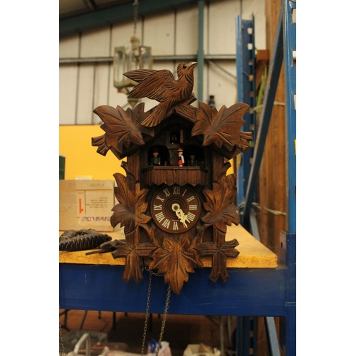 67 - A HAND CARVED BLACK FOREST STERNREITER CUCKOO CLOCK VENDOR STATES IN WORKING ORDER BUT NO WARRANTY G... 