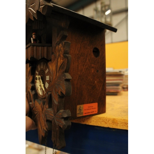 67 - A HAND CARVED BLACK FOREST STERNREITER CUCKOO CLOCK VENDOR STATES IN WORKING ORDER BUT NO WARRANTY G... 