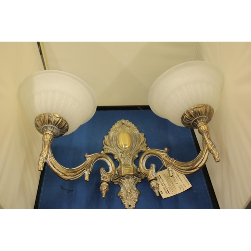 72 - AN OBEROQ BROTHERS MAJESTIC TWO LIGHT WALL BRACKET WITH WHITE GLASS SHADES