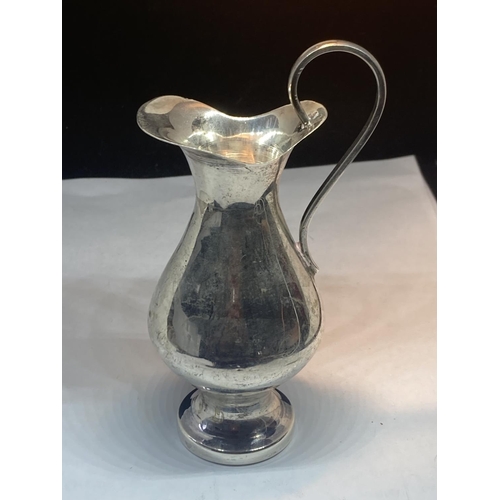 84 - A MARKED 900 SILVER JUG GROSS WEIGHT 92.1 GRAMS