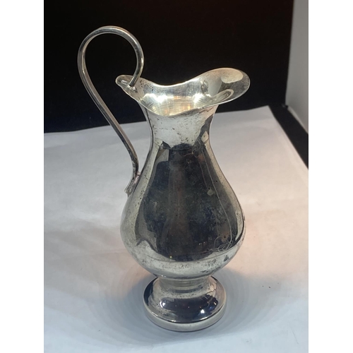 84 - A MARKED 900 SILVER JUG GROSS WEIGHT 92.1 GRAMS