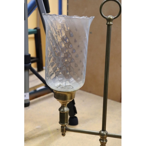 988 - A BRASS TWO-ARM STUDENT CANDLE LAMP WITH HURRICANE SHADES