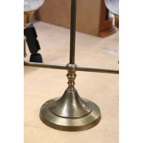 988 - A BRASS TWO-ARM STUDENT CANDLE LAMP WITH HURRICANE SHADES