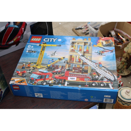 1684 - AN ASSORTMENT OF TOYS TO INCLUDE A BOXED LEGO CITY SET, A HARRY POTTER LEGO NIGHT BUS AND A MARIOKAR... 