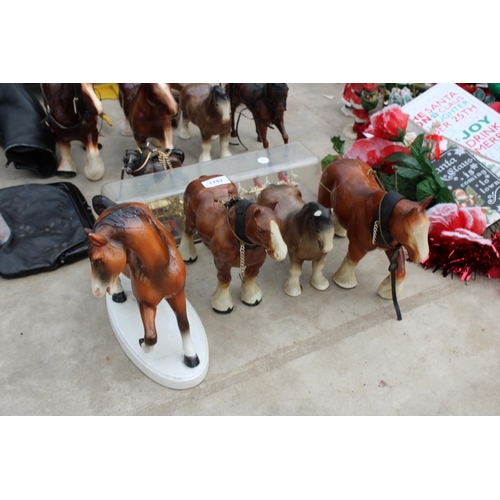 1742 - AN ASSORTMENT OF CERAMIC MODEL HORSES TO INCLUDE TWO CARTS