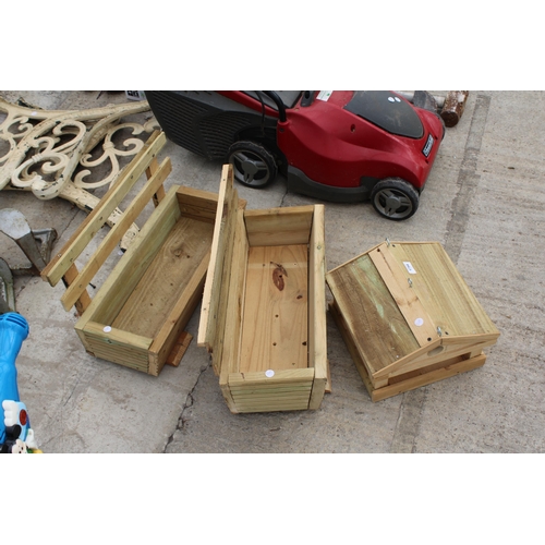 1754 - TWO WOODEN TROUGH PLANTERS AND A BIRDTABLE TOP