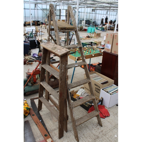 1690 - TWO VINTAGE WOODEN STEP LADDERS TO INCLUDE A FIVE RUNG AND A THREE RUNG