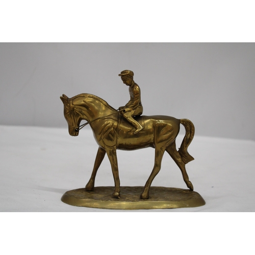 167 - A DETAILED HEAVY BRASS HORSE AND JOCKEY FIGURE, HEIGHT 16CM, LENGTH 17CM