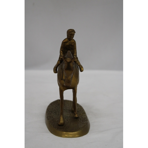 167 - A DETAILED HEAVY BRASS HORSE AND JOCKEY FIGURE, HEIGHT 16CM, LENGTH 17CM