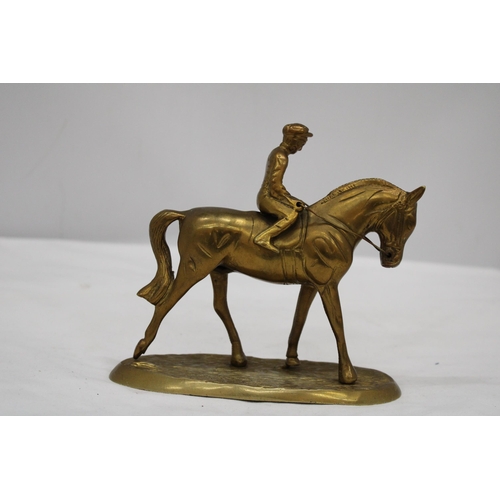 167 - A DETAILED HEAVY BRASS HORSE AND JOCKEY FIGURE, HEIGHT 16CM, LENGTH 17CM