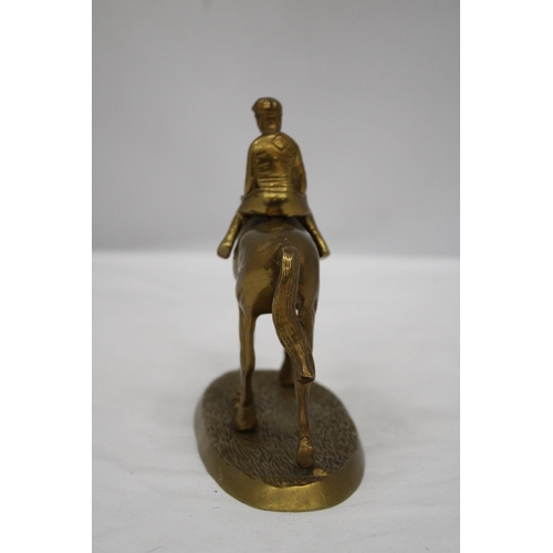 167 - A DETAILED HEAVY BRASS HORSE AND JOCKEY FIGURE, HEIGHT 16CM, LENGTH 17CM