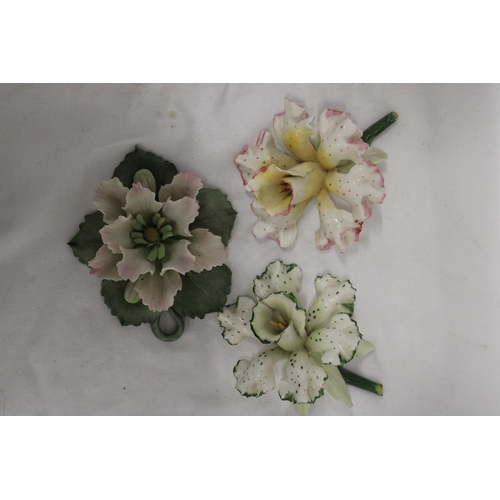 202 - THREE DELICATE CERAMIC FLOWERS