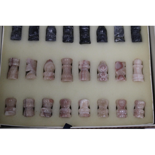 203 - A VINTAGE MARBLE CHESS BOARD AND CHESS PIECES - COMPLETE