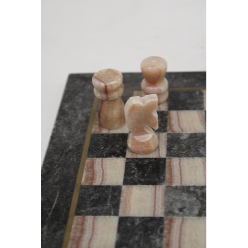 203 - A VINTAGE MARBLE CHESS BOARD AND CHESS PIECES - COMPLETE