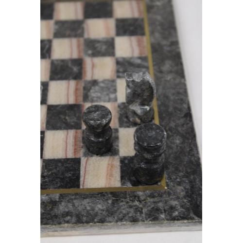 203 - A VINTAGE MARBLE CHESS BOARD AND CHESS PIECES - COMPLETE