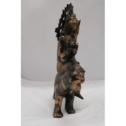 209 - A BRONZE EXOTIC INDIAN MOTHER GODDESS ON A TIGER'S BACK, HEIGHT 38CM, LENGTH 28CM