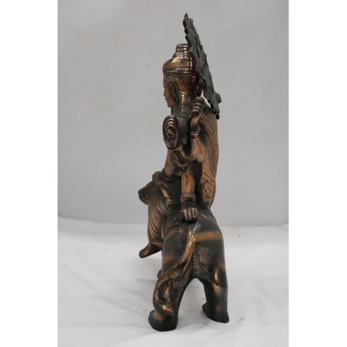 209 - A BRONZE EXOTIC INDIAN MOTHER GODDESS ON A TIGER'S BACK, HEIGHT 38CM, LENGTH 28CM