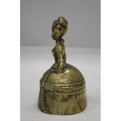 214 - A VINTAGE BRASS BELL MODELLED AS A VICTORIAN WOMAN