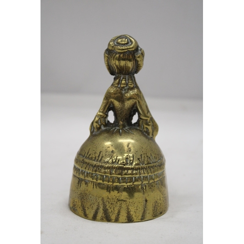 214 - A VINTAGE BRASS BELL MODELLED AS A VICTORIAN WOMAN