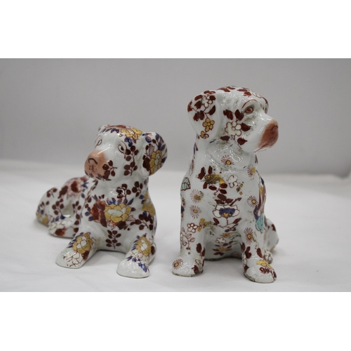 227 - A PAIR OF FLORAL DOGS, ONE WITH ORIENTAL MARKS TO THE BASE