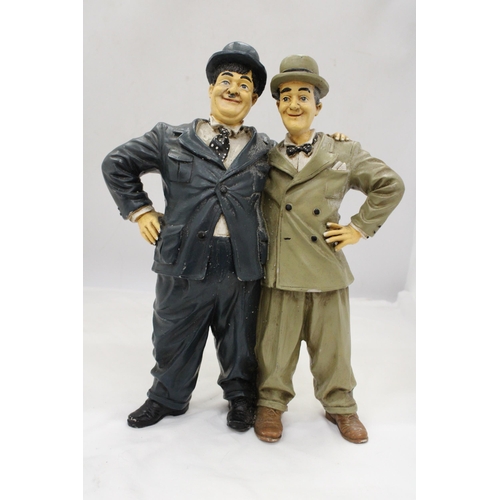 254 - A LARGE FIGURE GROUP OF LAUREL AND HARDY, HEIGHT 37CM