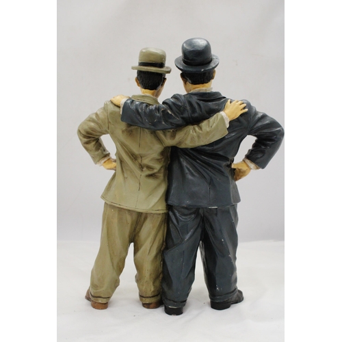 254 - A LARGE FIGURE GROUP OF LAUREL AND HARDY, HEIGHT 37CM