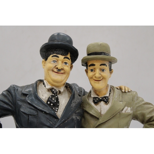 254 - A LARGE FIGURE GROUP OF LAUREL AND HARDY, HEIGHT 37CM