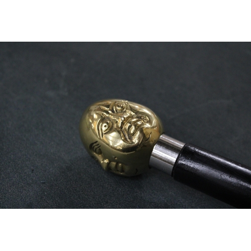 817 - A BRASS FOUR FACED BUDDHA HANDLE WALKING STICK