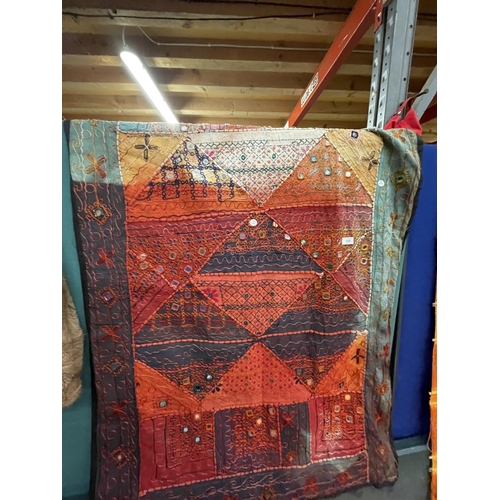 100 - A RED AND TURQUOISE TAPESTRY, 98CM X 144CM