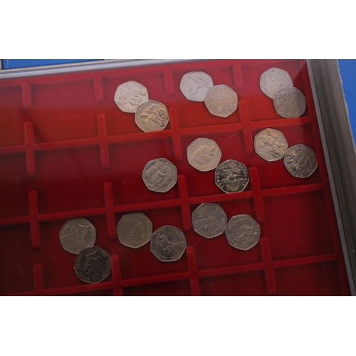 486 - UK 50P COIN COLLECTION ARRANGED IN THREE LINDNER TRAYS  68 IN TOTAL ,UNCHECKED, CAREFUL EXAMINATION ... 