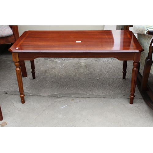 3000 - A MODERN POLISHED HARDWOOD COFFEE TABLE WITH CANTED CORNERS ON TURNED AND FLUTED LEGS, 37