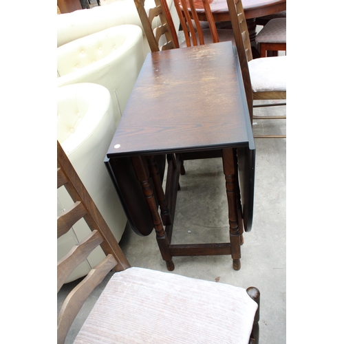 3002 - A MODERN OAK GATE-LEG DINING TABLE ON TURNED LEGS AND FOUR LADDER-BACK DINING CHAIRS