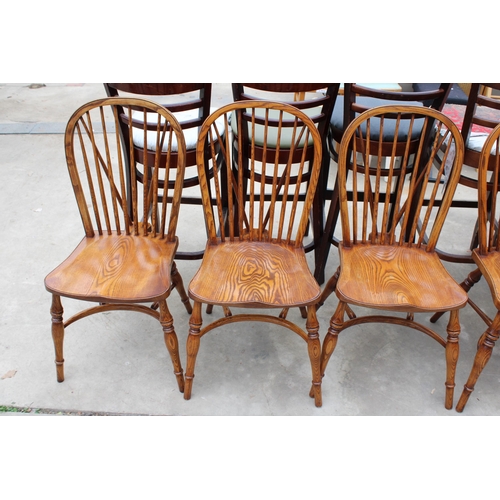 3024 - A SET OF EIGHT ELM R.W.F.CO WINDSOR STYLE DINING CHAIRS WITH STICK BACKS AND CRINOLINE BOWS