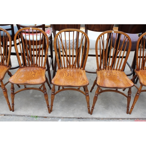 3024 - A SET OF EIGHT ELM R.W.F.CO WINDSOR STYLE DINING CHAIRS WITH STICK BACKS AND CRINOLINE BOWS