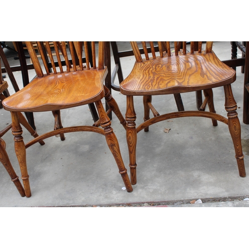 3024 - A SET OF EIGHT ELM R.W.F.CO WINDSOR STYLE DINING CHAIRS WITH STICK BACKS AND CRINOLINE BOWS