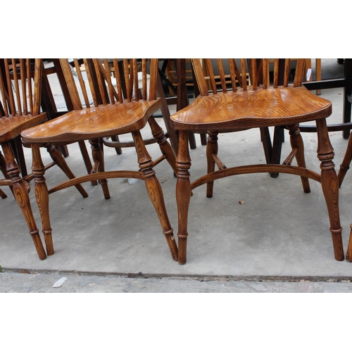 3024 - A SET OF EIGHT ELM R.W.F.CO WINDSOR STYLE DINING CHAIRS WITH STICK BACKS AND CRINOLINE BOWS