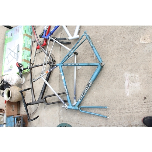 1786 - THREE VARIOUS BIKE FRAMES TO INCLUDE A CANNONDALE AND A PEUGEOT ETC