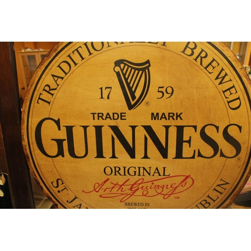 51 - A LARGE WOODEN CIRCULAR GUINESS ADVERTISING SIGN 24