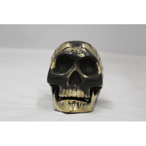 124 - A BRONZE SKULL