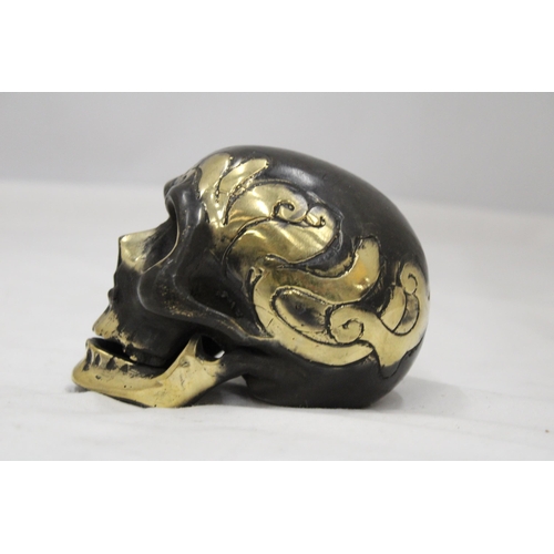 124 - A BRONZE SKULL