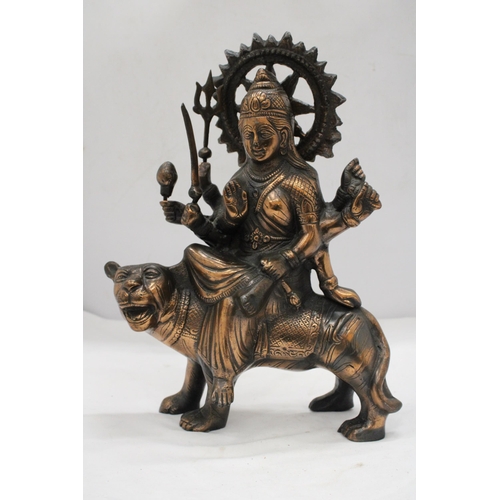 209 - A BRONZE EXOTIC INDIAN MOTHER GODDESS ON A TIGER'S BACK, HEIGHT 38CM, LENGTH 28CM